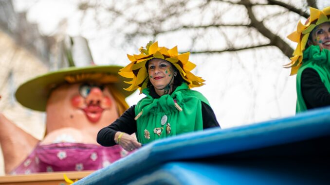 woman in green and yellow hat and black jacket