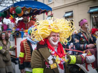 woman in yellow wig and green jacket